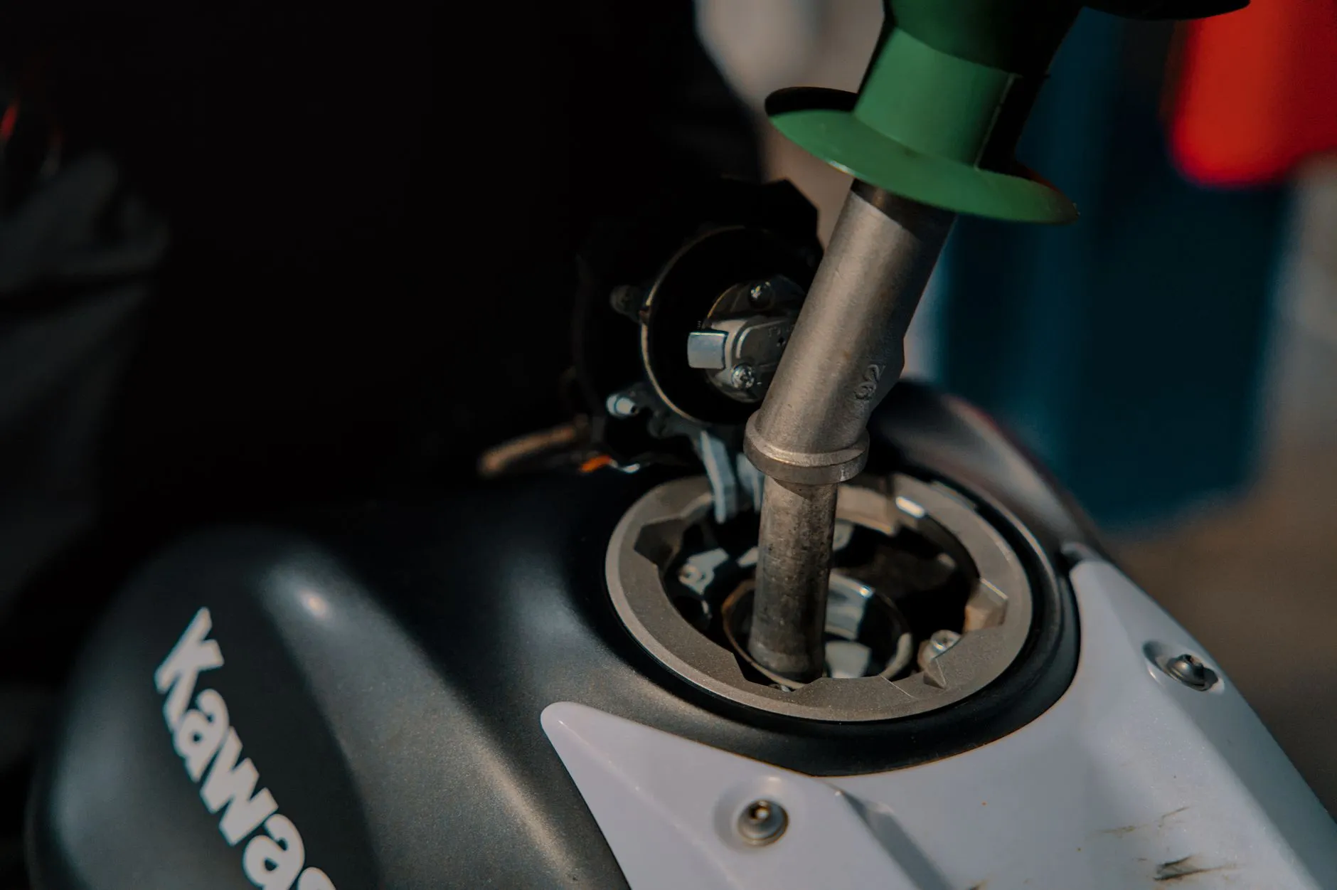 motorcycle fuel stabilizer bottle on garage shelf